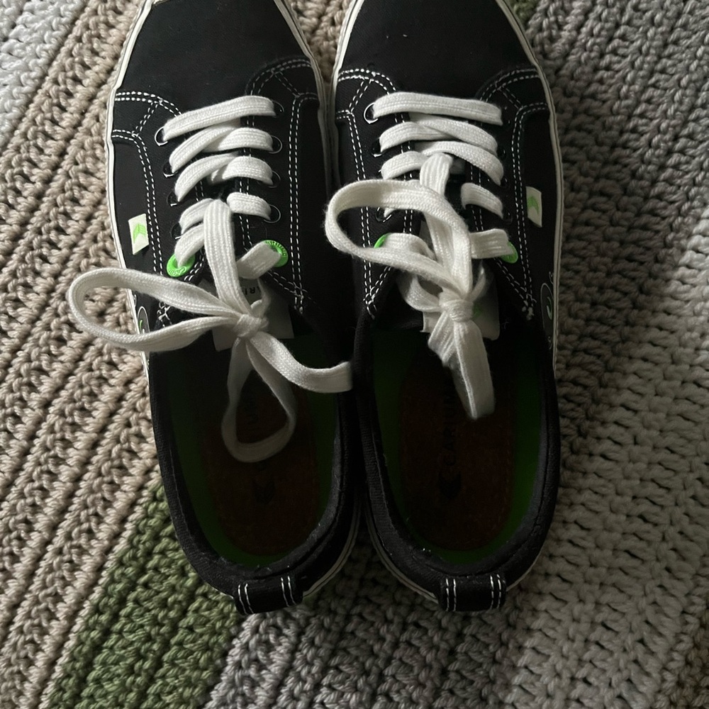 Black and White Sneakers with Green Accents